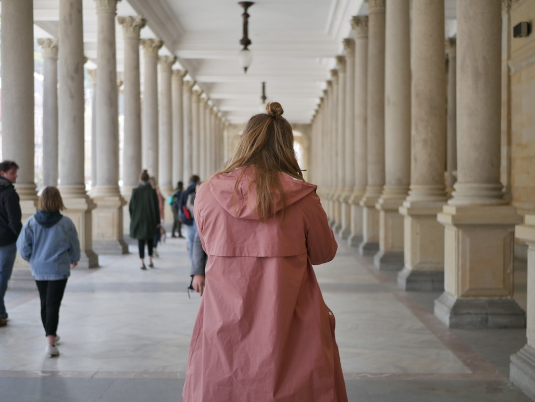woman in burgundy faux fur jacket