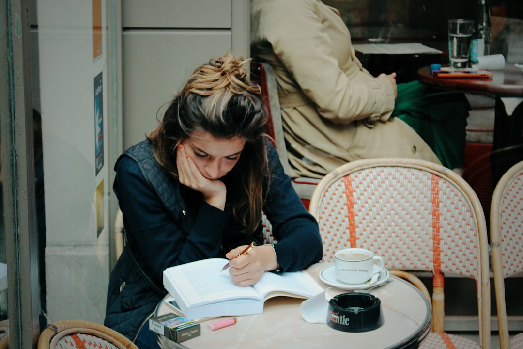 woman journaling with cup of tea