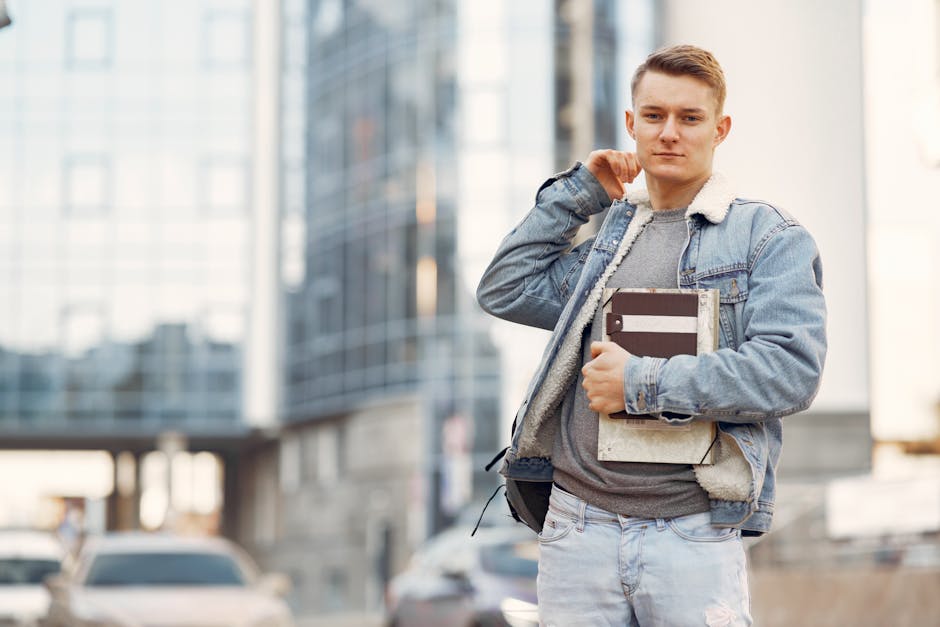 College student wearing vintage denim jacket and modern accessories