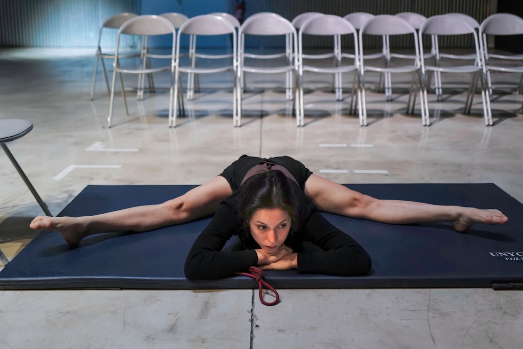 Woman doing yoga in a bright home studio