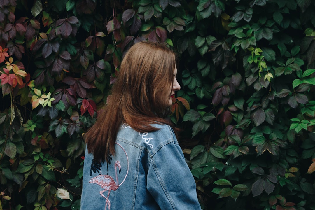 Embroidered denim jacket with single flower