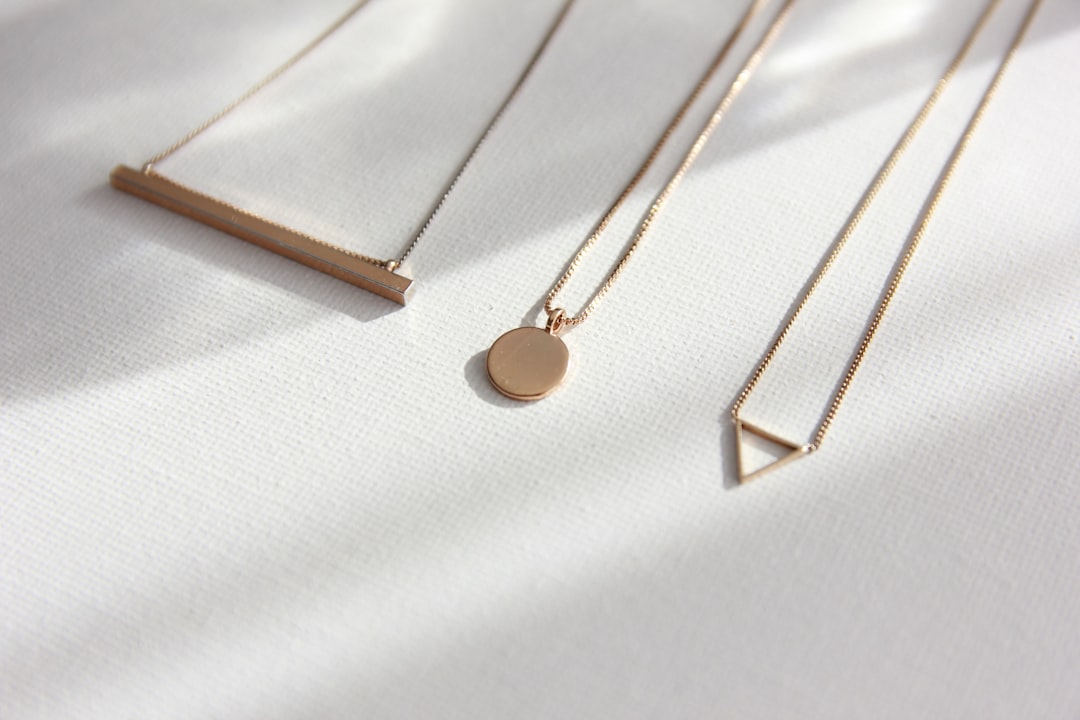 Gold layered necklaces on a spring outfit