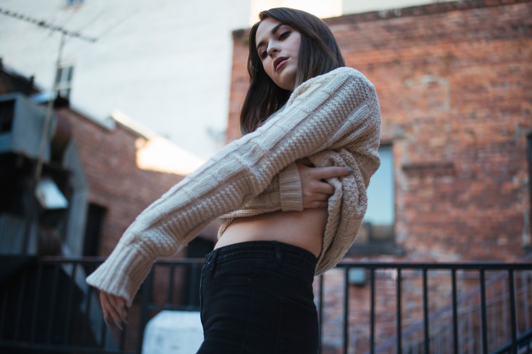 Woman wearing knit bandeau top and jeans